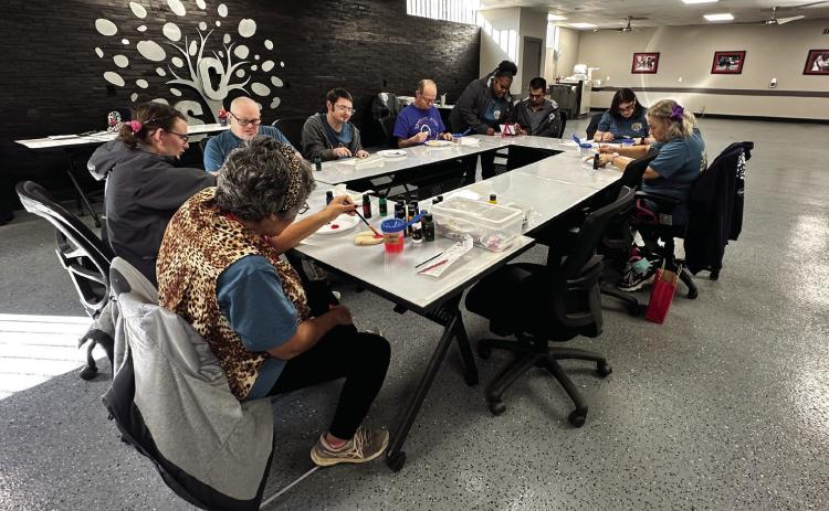SCI Adult Day Center attendees participate in craft time. Photo provided