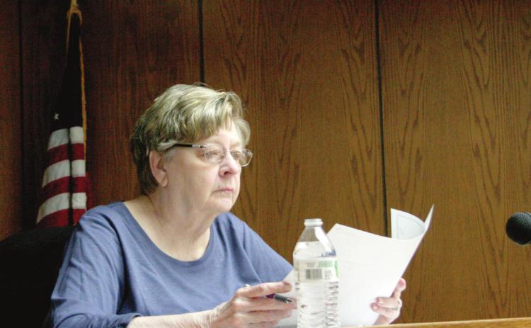 Ward 1 City Commissioner Linda Farris contemplates a proposed truck route map during Monday night’s Tecumseh City Council Meeting. Countywide &amp; Sun/Kendra Johnson