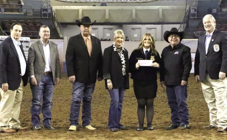 Pictured from left: OYE Vice Chairman Jimmy Harrel, AFR Board Member Ron Ramming, AFR Cooperative Vice President Toby Wallace, Executive Operation Coordinator Ashley White, Poppy Robinson, AFR Cooperative President Scott Blubaugh, and AFR Agent Randy Gilbert. Photo provided by AFR