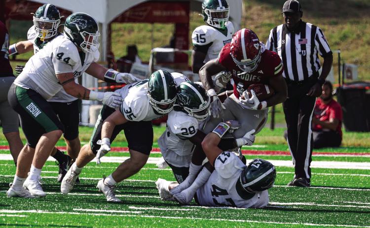 Bison swarm the Henderson player for the tackle. Oklahoma Baptist lost the game 52-7. Photo provided by OBU