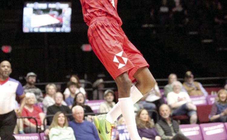 Potawatomi Fire Forward Ricky Artis II makes a slam dunk in the second quarter of the March 14 home game against the Enid Outlaws at FireLake Arena. The Fire triumphed, 150-94. Natasha Dunagan, Countywide & Sun