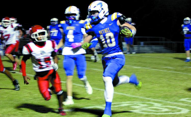 Bethel senior Luke Quinter makes his way to a touchdown during the Oct. 31 homecoming game, after escorting Homecoming Queen Lilly Jordan. The Wildcats won against Okmulgee 46-0.