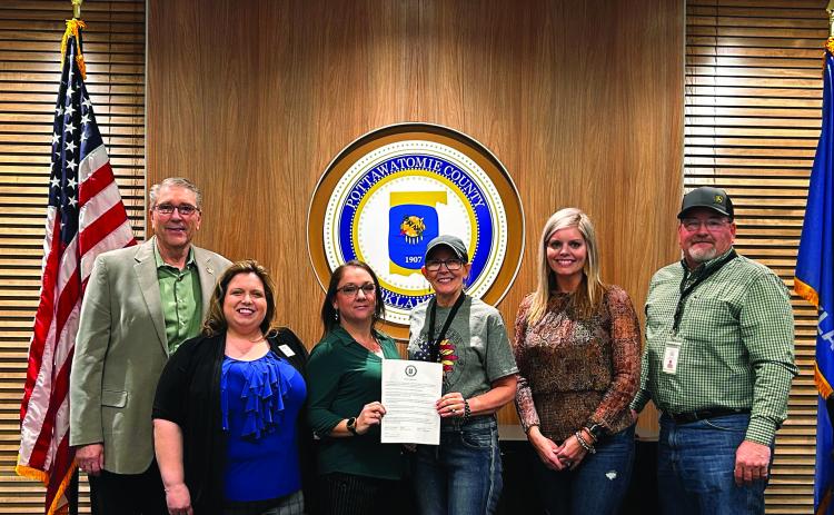 Pictured from left Robert Richards, April Grant, Ronelle Baker, Commissioners Melissa Dennis, Abby Thompson, and Greg Rush pose for a photo after the meeting. Countywide &amp; Sun/Suzie Campbell
