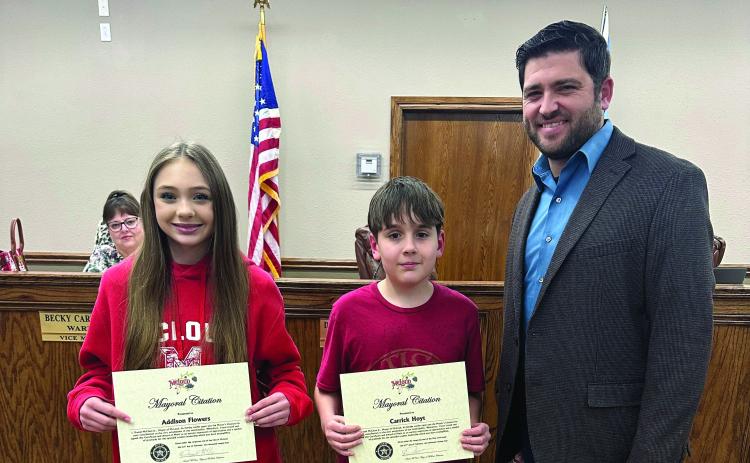Addison Flowers (left) and Carrick Hoyt (right) of McLoud Public Schools were each presented a Mayoral Student Citizen of the Month Citation by Mayor Daniel McClure during the monthly meeting of the McLoud City Council Thursday, Feb. 22. Photo provided