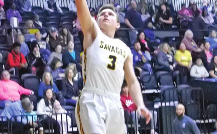 Tecumseh’s Brady Overstreet tries for a basket during the homecoming game against Little Axe on Jan. 28. The Savages won 72-35.