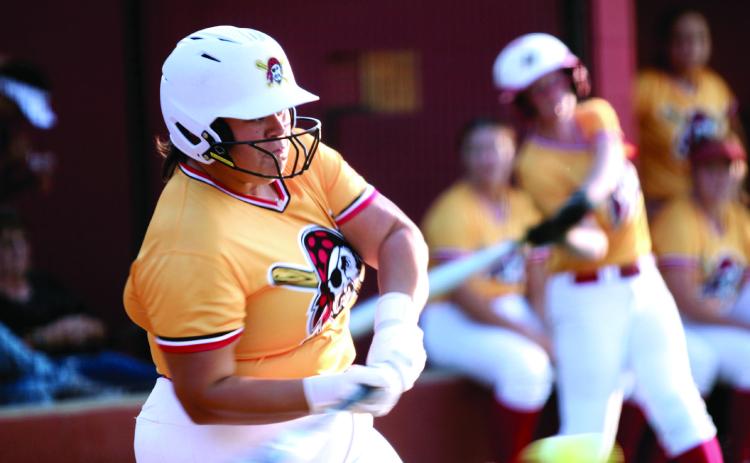 Dale senior Kelby Welcher makes contact at bat during the Dale-Tecumseh Fast Pitch Tournament game against Purcell on Sept. 4. The Lady Pirates won four of the five games they played during the three-day tournament. Natasha Dunagan, Countywide &amp; Sun