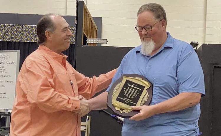 Tim Underwood accepts a plaque of appreciation from Tecumseh Board President, Todd Kennedy. Underwood’s seat remains vacant as the school board seeks candidate interest. Countywide &amp; Sun/Julie Talton