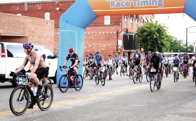 About 58 bicyclists from all over Oklahoma take off on the Fenrir Unchaind bike race, starting in front of spOKeLAHOMa in Tecumseh, on June 3. Participants could choose from four distances: 39, 70, 140 and 210 miles. Ryan Roggow of Shawnee placed first in the 210-mile “Ragnarock” race. Craig McIntyre, co-owner of spOKeLAHOMA, said there were 95 people who registered from five states and New England. Countywide & Sun/Natasha Dunagan