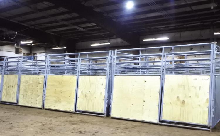 A long row of refurbished stall panels have new wood and straightened or replaced steel pipe. The panels are ready to be painted and then be set for the upcoming horse show. File photo