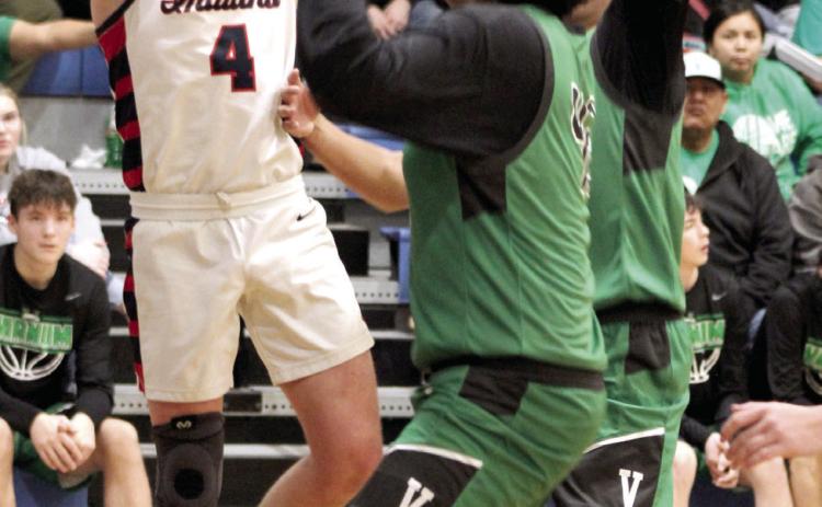 Asher’s Kelby Fowler takes a shot in the Jan. 2 home game with Varnum. The Indians won, 59-48.
