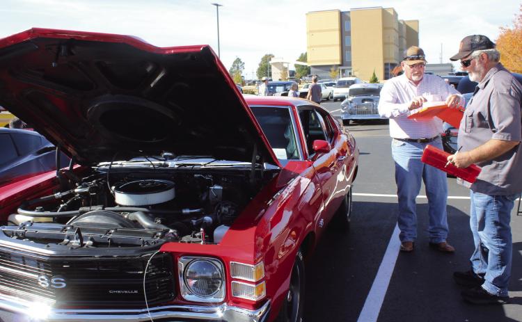 Pott. Co. Commissioner Greg Rush and Shawnee Mayor Eric Stephens judge a 1971 Chevelle SS at the First Annual Driven for Justice Car Show, held at Life. Church in Shawnee on Nov. 8. The car show raised more than $5,000 for the Child Advocacy Center of Central Oklahoma. Natasha Dunagan, Countywide &amp; Sun
