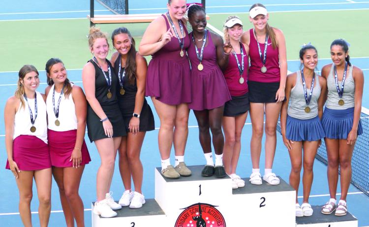 Tecumseh #1 Doubles Team Laycee Thoma and Jalee Meyers, both seniors, stand on the podium after playing four rounds and winning third place during the Class 4A State Girls Tennis Tournament. Lili Lowden, Kalyn Bartmess, Kyann Sells, and Amanda Magill also competed at state on May 9-10 in OKC. Photo courtesy of Jennifer McKnight