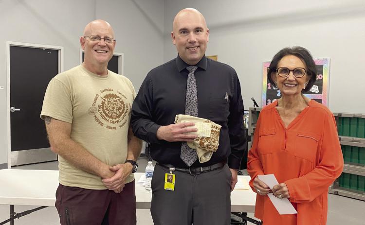 Craig MacIntyre, Robert Kinsey and Linda Capps pose at the Tecumseh School Board Meeting where spOKeLAHOMA’s Oklahoma Gravel Growler event hosted a fundraiser and Citizen Potawatomi Nation wrote a check for $2,423 to TPS. Countywide & Sun/Julie Talton