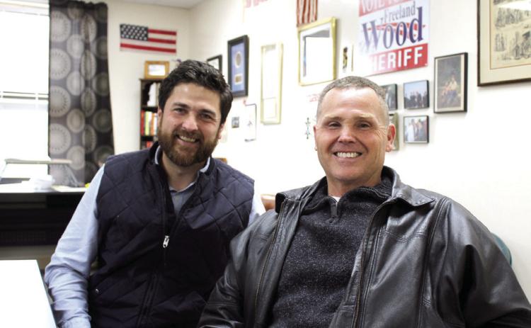 Justin Wood, the Tecumseh Public Schools Director of Community Engagement, poses with his father, Freeland Wood, who is the Pottawatomie County Sheriff Elect. F. Wood was a police officer for the City of Shawnee, Shawnee High School and North Rock Creek for 36 and a half years before winning the Sheriff’s election this year. Countywide &amp; Sun/Natasha Dunagan