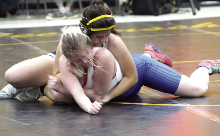 Tecumseh wrestler Jessica Fullbright tries to flip her Chandler opponent on Dec. 15 during a meet at the Alumni Center. The Tecumseh Lady Savages won 42-11. Countywide &amp; Sun/ Natasha Dunagan