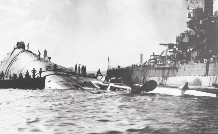 USS Oklahoma capsized next to the USS Maryland. Photo provided