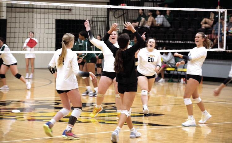 The Lady Savage Volleyball team celebrate with an awesome opening win over Harding Charter School Thursday, Aug. 11, 2022. Countywide &amp; Sun/Danny Chambers