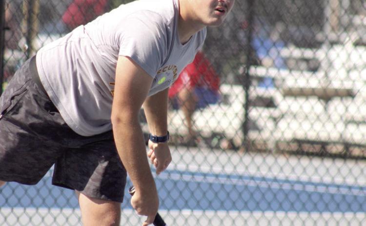 Noah Henson, on the Tecumseh #1 Doubles team with Ted Belshe, watches the ball after making his stroke during the Shawnee NGB (National Governing Body) Tournament on May 3. They were playing Shawnee. Natasha Dunagan, Countywide &amp; Sun
