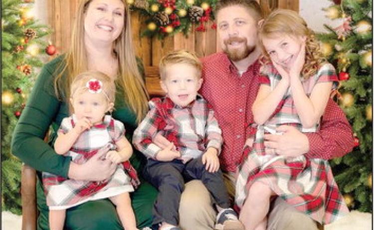 Dr. Aaron Espolt is pictured with his family above. Photo provided