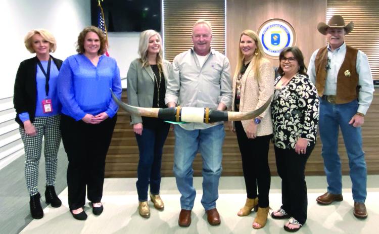 Elected officials wish Dist. 2 Pottawatomie County Commissioner Randy Thomas well on his retirement. Dist. 1 Commissioner Melissa Dennis presented Thomas with a set of longhorns. Pictured from left are Assessor Leona Satterfield, Court Clerk Valerie Ueltzen, Dist. 3 Commissioner Abby Thompson, Thomas, Dennis, Election Secretary Patricia Carter, and Sheriff Mike Booth.