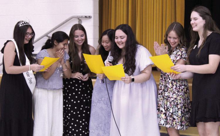 Seven Lady Savage 2026 graduates have fun leading the audience in the 'THS Fight Song' at the 124th Annual Tecumseh Alumni Banquet, held at the WP Wood THS Alumni Center on May 30. Shown, from left, are Avery Renken, Amy Moreno, Maggie Johnson, Kelsy Nguyen, Cheyanna Dietz, Addison Taron and Adalaide Lack.