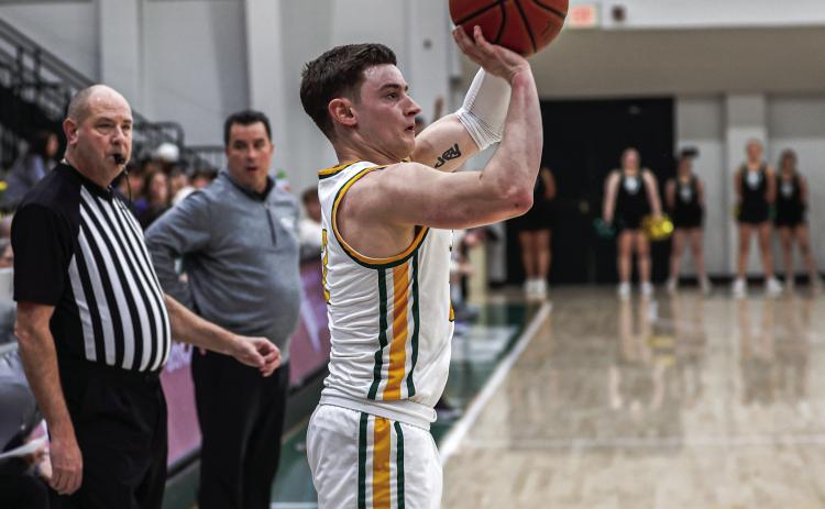Oklahoma Baptist University’s Ethan Scott launches a three-point shot in the 75-72 win over Henderson Saturday, Jan. 18. Scott finished the game with a career-high 22 points. Photo provided by OBU