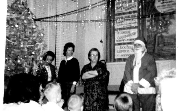 Santa Claus visits New Hope School in 1964. Dr. Donald Rominger was a teacher there in the school year of 1961-’62 and has fond memories of Santa handing out bags of “treats, candies and fruits” to the students. Photo courtesy of the Collection of Glenn Dale and Kathryn Carter.