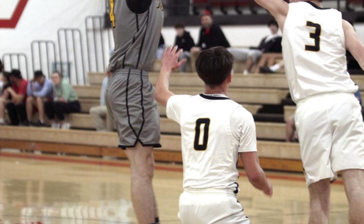 Tecumseh senior Brodey Wood aims for a trey . Natasha Dunagan, Countywide &amp; Sun