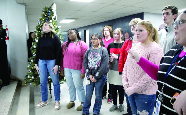The Shawnee High School Jazz Choir sings “Happy Birthday” to Band Director Christopher Hall before the Dec. 2 Board of Education meeting. Countywide & Sun/Natasha Dunagan