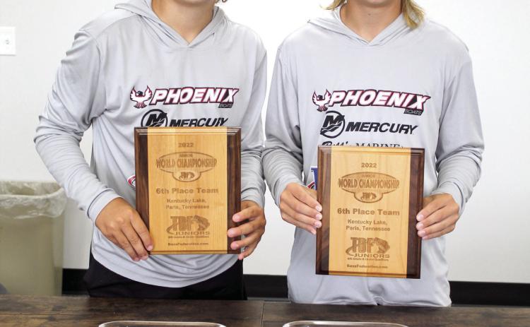 Madden McKiddy and Maddox Dickson, both of Tecumseh, pose with their fishing trophies for the Oklahoma TBF Junior Championship and the TBF Junior World Championship on Aug. 4. Countywide &amp; Sun/ Natasha Dunagan
