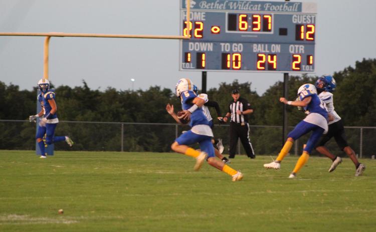 Bethel sophomore Bryce Tapley (#5) runs the ball, as junior Reagan Curry (#10) blocks a Classen SAS player during the season opening home game on Sept. 2. Bethel won 43-12. Countywide & Sun/Natasha Dunagan