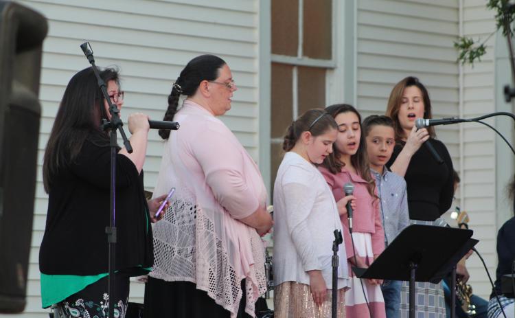 A group from Holiness Church sings "It Only Takes One" during the Frontier Days Gospel Sing at Broadway Chapel, in Tecumseh, Sept. 15. Four groups and two individuals from area churches participated in the Gospel Sing. Countywide & Sun/Natasha Dunagan