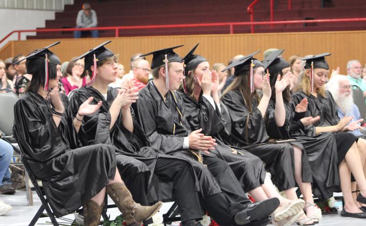 Macomb High School graduates clap and cheer for English teacher Mandy Blankenship after her speech during the Commencement Ceremony on May 6. Countywide & Sun/Natasha Dunagan