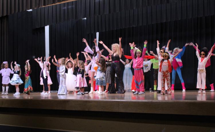 Twenty-seven contestants in the Tot, Little, Junior and Miss Frontier Days Pageant perform the musical number dressed in period costumes for the “Remember When” theme. The pageant was held on Sept. 24 at the W.P. Wood Alumni Center at Tecumseh High School, but the Junior and Miss contestants will be crowned before the Frontier Days Parade on Sept. 30. Countywide & Sun/Natasha Dunagan