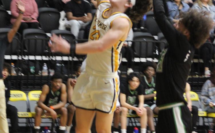 Tecumseh's Macen McKiddy puts one through the hoop after catching a pass from Jackson Martin in the second quarter of the Class 4A Distirct game against Harding Charter on Feb. 16. The Savages won, 75-74, and will play in Regional competition today (Feb. 22) in Douglass, along with the Lady Savages who also won Districts. Countywide & Sun/Natasha Dunagan