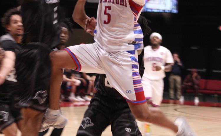 Potawatomi Fire power forward Ruston Hayward flies into the Enid Outlaws defense as he takes his shot during their first game of the third season on March 1. The Basketball League National Champions beat the Outlaws at FireLake Arena, 136-91. Countywide & Sun/Natasha Dunagan