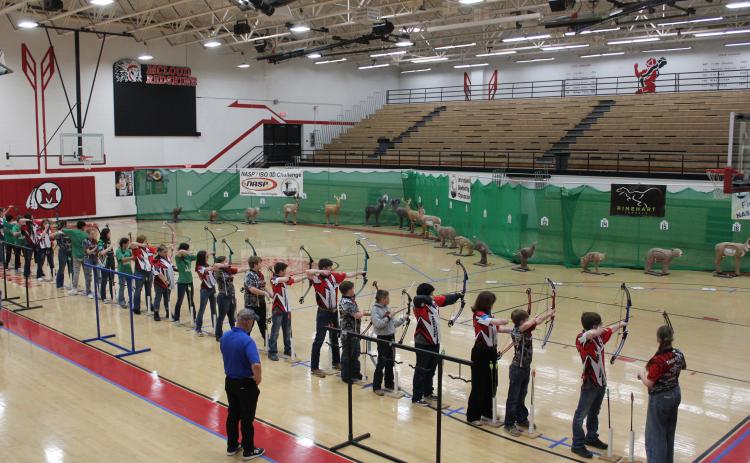 Archery students from McLoud Middle School and High School and other schools line up to shoot at 3D targets during the 2024 Oklahoma State NASP®/IBO 3D Challenge, held at McLoud on March 2. There were 26 schools and 413 students in fourth grade through senior competing that day. This is the second time for McLoud to host a 3D archery tournament. Countywide & Sun/Natasha Dunagan
