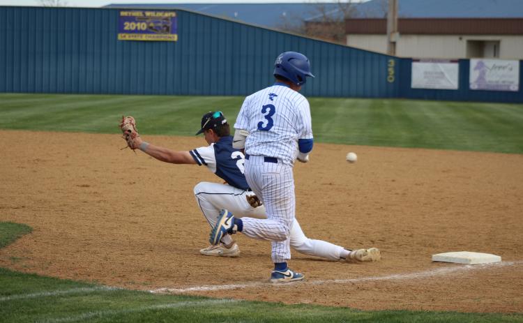 Bethel freshman Maddox Davis runs to first, as Asher senior Brogan Culwell tries for the catch during the Bethel Festival, March 29. The Wildcats beat the Indians, 14-5, and they stomped the OKC Mets, 6-1. Countywide & Sun/Natasha Dunagan