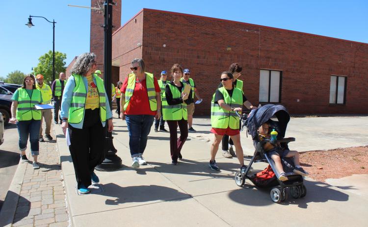 Residents, local leaders and others set out from Tecumseh City Hall on the Tecumseh Walking Audit for first-hand experience walking the streets of T-town and to recommend improvements on April 12. They were led by Holly Gordon, from the TSETHealthy Living Program, fourth from left. Countywide & Sun/Natasha Dunagan