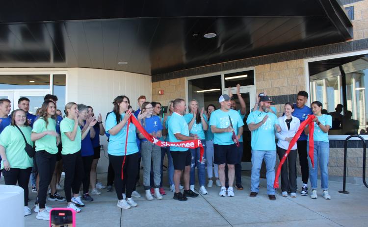 Everyone applauds as Shawnee YMCA CEO Mike Jobe cuts the ribbon, with the help of board members, employees, and others, to officially reopen the Troy and Dollie Smith Family YMCA on April 6, almost a year after it was hit by the April 19, 2023 tornado. Jobe later said approximately 1,800 people attended the Grand Reopening party. Countywide & Sun/Natasha Dunagan