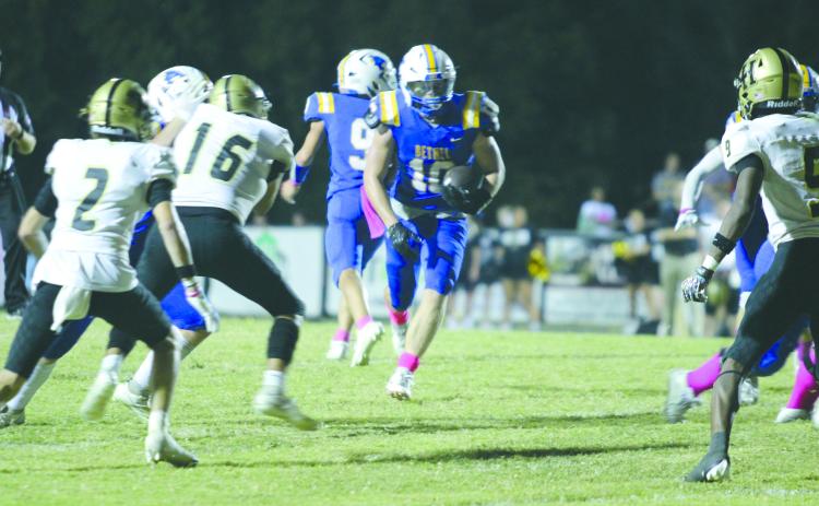 Bethel junior Luke Quinter finds a path through the Hugo defense on his way to a touchdown at the Oct. 4 Bethel "Pink Out" home game. The Wildcats lost, 24-38. Countywide & Sun/Natasha Dunagan