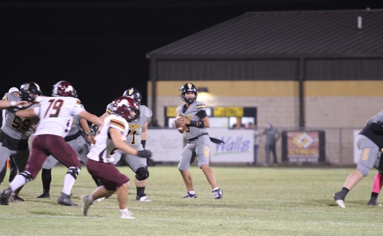 Tecumseh senior Hollin Barnes looks for an opening to pass during the second quarter of the Oct. 10 home game against Blanchard. The Savages lost, 7-34. Countywide & Sun/Natasha Dunagan