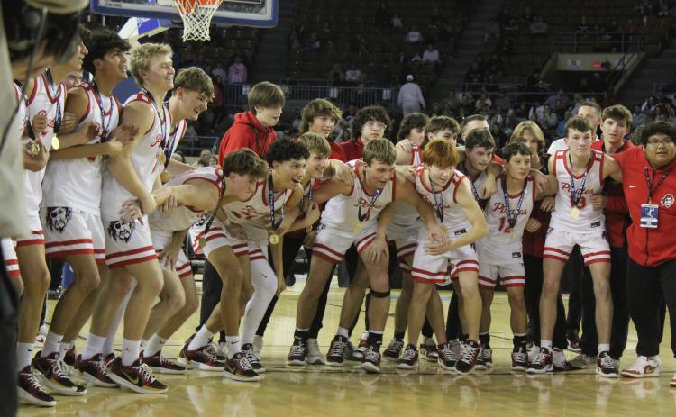 The Dale Pirates Basketball Team prepares to run up and claim the golden basketball trophy after winning the OSSAA Class 2A Basketball State Championship on March 8 at the State Fair Arena. The Pirates won against Cashion on March 6, 74-55; Fairland on March 7, 76-51; and, Pocola on March 8, 60-20, to take state for the fourth year straight. They end the season with a record of 30-2. Natasha Dunagan, Countywide & Sun