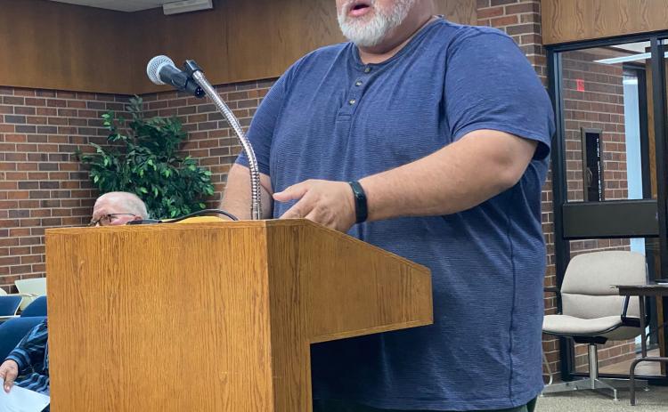 Code Enforcement Officer, James Smith, discusses safety concerns of a property on the agenda to be demolished. By Julie Talton, Countywide & Sun