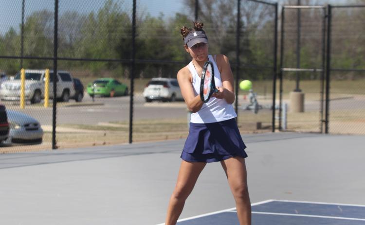 Shawnee freshman December Nanaeto keeps her eye on the ball in #2 Singles against Elgin during the East/West Quad Tournament on March 25. Nanaeto won her match, 7-6, 6-2. Natasha Dunagan, Countywide & Sun