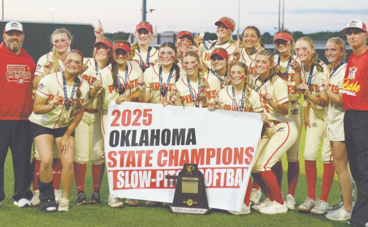 The Dale Lady Pirates Slow Pitch Team poses with Assistant Coach Eric Muncy, far left, and Head Coach Andy Powell, far right,  after winning the Class 4A State Championship at FireLake Ball Fields on May 8. They won all three games - with Calera, 12-1; Haskell, 4-1; and, Pocola, 11-10. Photo courtesy of Brian Blancett, Lincoln County News