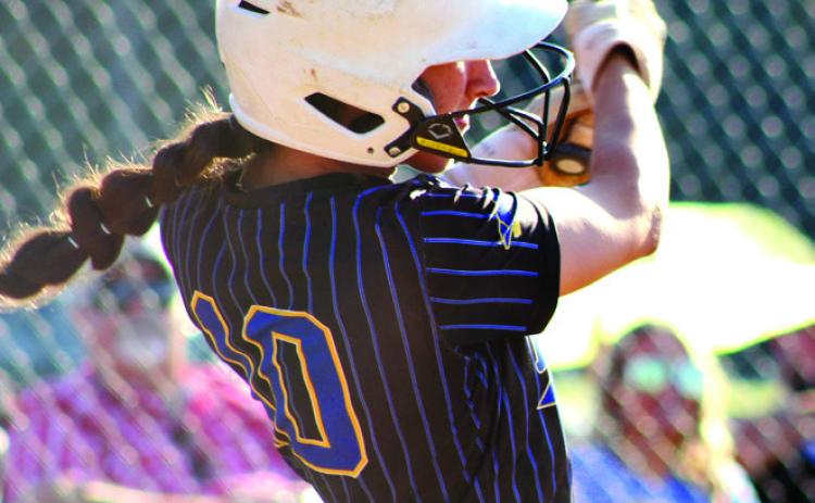 Left: Bethel senior Layla Menhusen dings a double in the Class 3A Regional Tournament game against Davis.