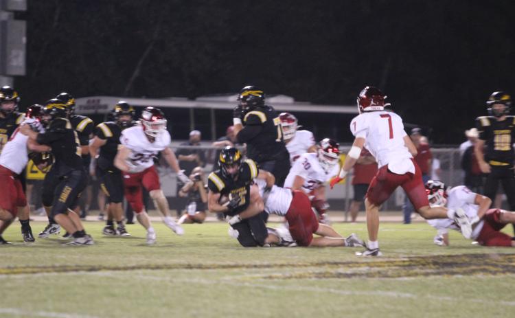 Tecumseh senior Wyatt McElfresh gains two yards for a third down in the second quarter of the Oct. 16 home game against Tuttle. File photo