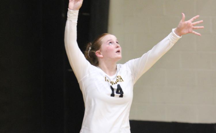 Tecumseh senior Channing Goodson keeps her eye on the ball as she serves  in the home match against North Rock Creek on Aug. 28.  File photo