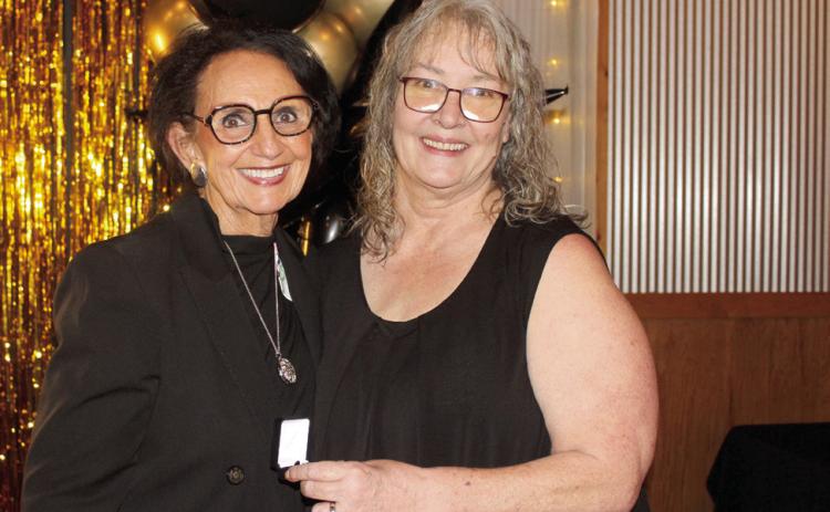 Suzie Campbell, Countywide & Sun owner and publisher, presents a Pottawatomie Power Poll Top 10 award to CPN Vice Chair Linda Capps. Natasha Dunagan, Countywide & Sun